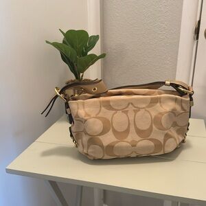 Small authen Coach purse. Cream and gold, leather straps. Gently used